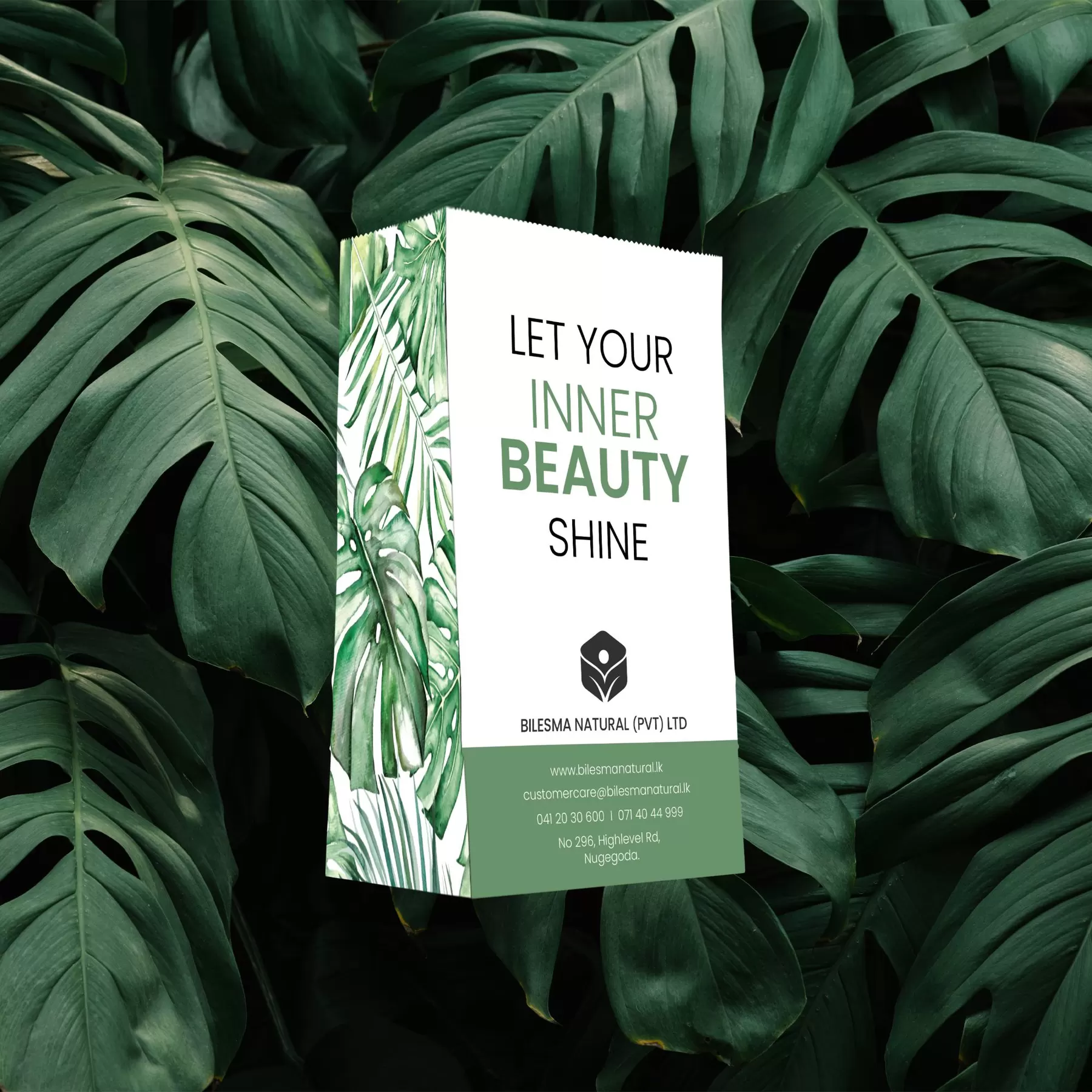 Bilesma Natural redesigned carry bag by Uniix Studio: white botanical bag reading Let Your Inner Beauty Shine, set among monstera leaves