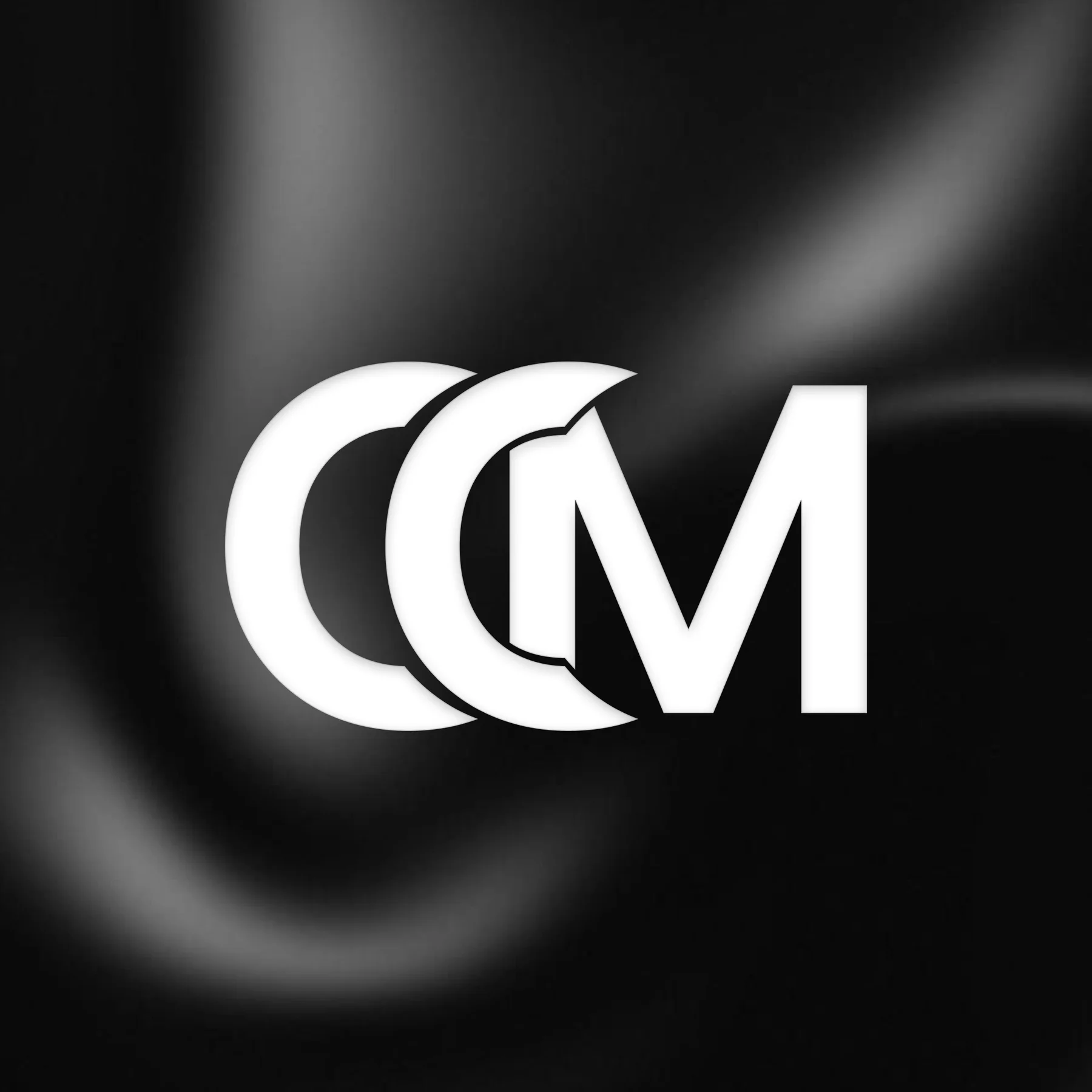 Cinecraft Media CM monogram in white on a black satin background